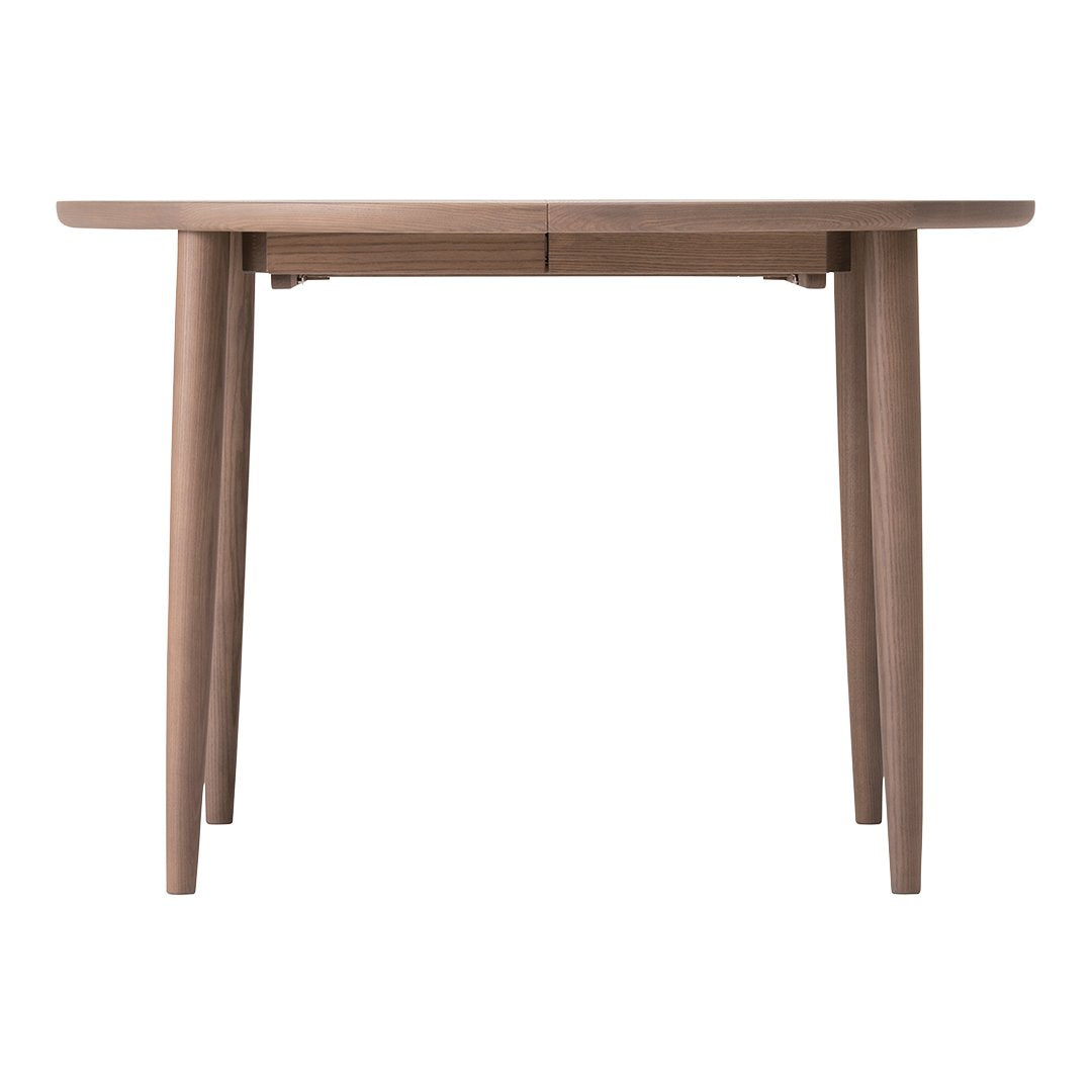 Light brown wooden table with sleek, minimalistic design and smooth surface. Ideal for modern decor.