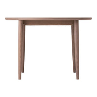 Light wood dining table with a smooth, minimalist design and natural grain patterns. Perfect for modern interiors.