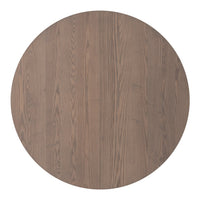 Round wooden table in a warm, muted brown finish with natural wood grain patterns. Ideal for modern decor.