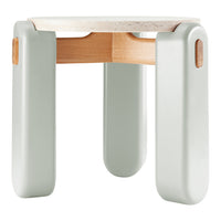 Light green stool with smooth, rounded legs and a textured cream top, combining modern design with natural elements.