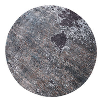 Round rug featuring a textured blend of gray, black, and hints of brown in a modern, abstract pattern.