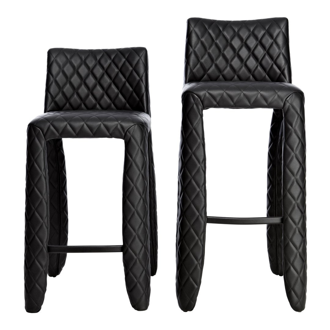 Black bar stools with a textured diamond pattern and sleek, minimalist design. Perfect for modern interiors.