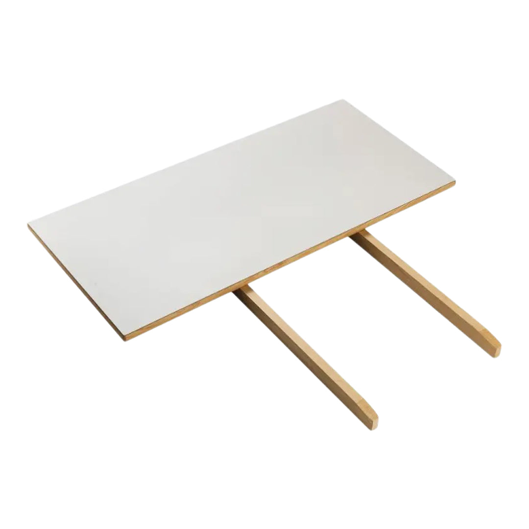 White tabletop with wooden legs, featuring a sleek, minimalist design. Ideal for modern decor.
