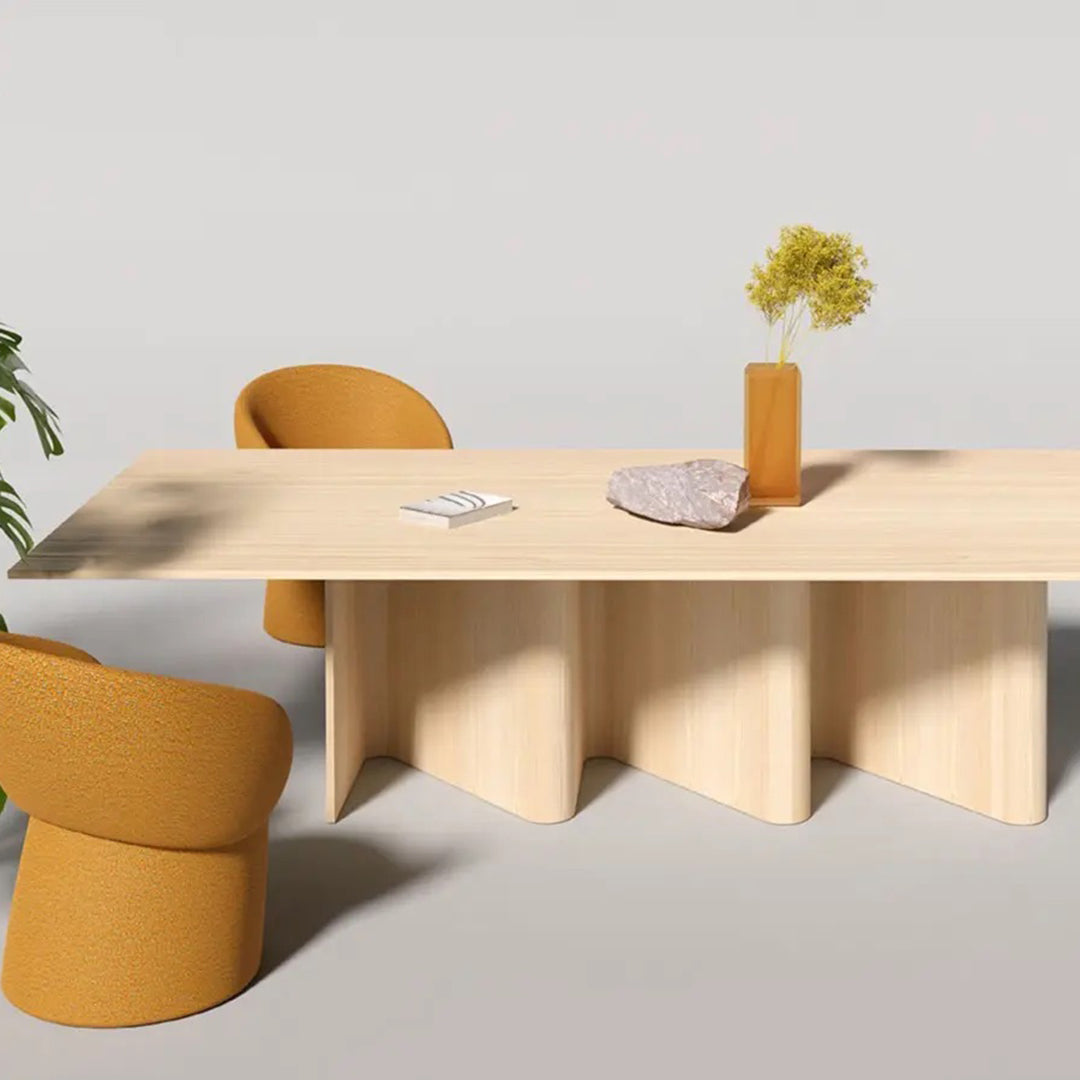 Stylish wooden table with beige finish, accented by mustard yellow chairs and a minimalist vase. Modern design elements.