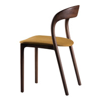 Modern chair featuring a warm mustard yellow seat and rich walnut wood legs, showcasing a sleek, minimalist design.