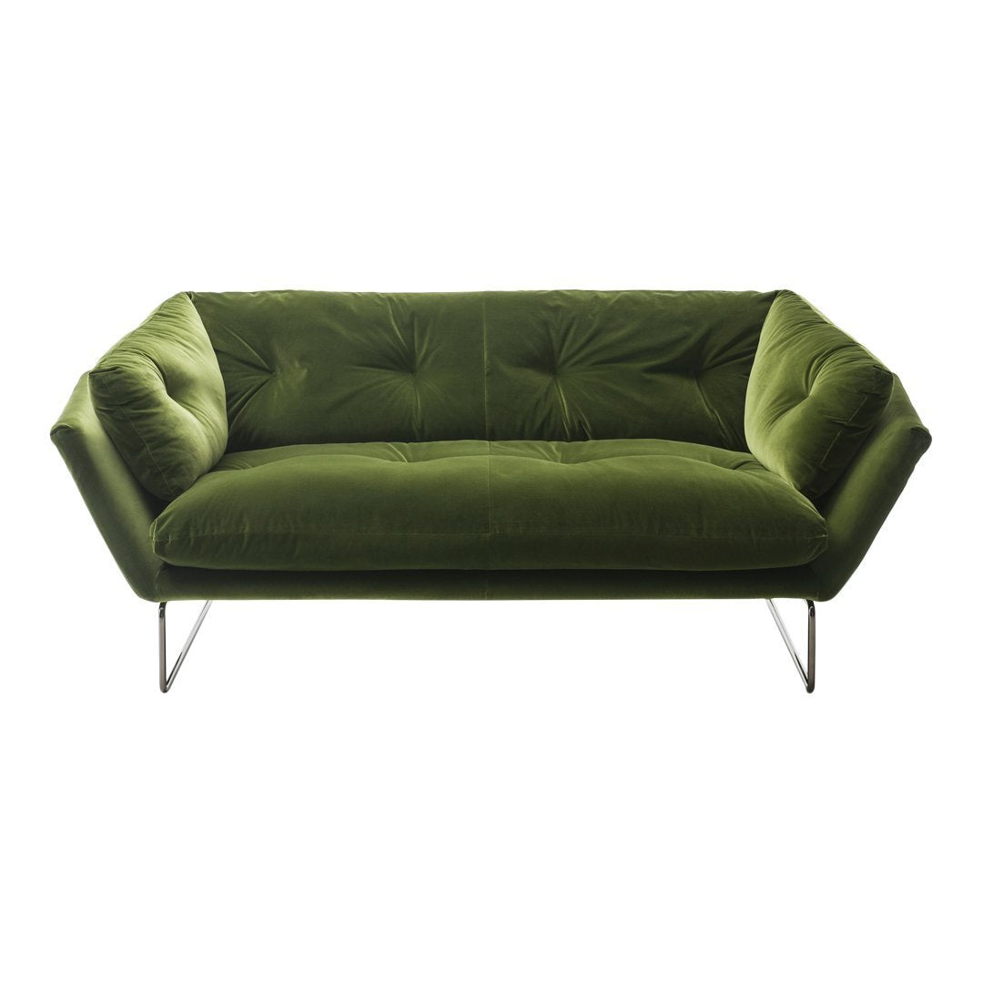Velvet green sofa with tufted design and sleek metal legs, perfect for modern decor.