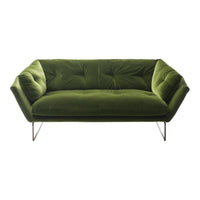 Velvet green sofa with tufted design and sleek metal legs, perfect for modern decor.