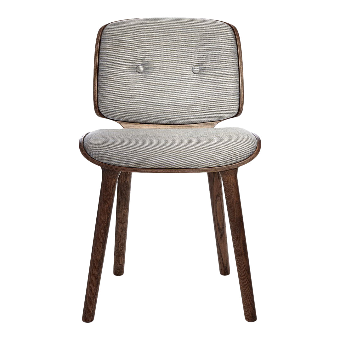 Light gray upholstered chair with button detailing and dark wood legs, featuring a minimalist design.