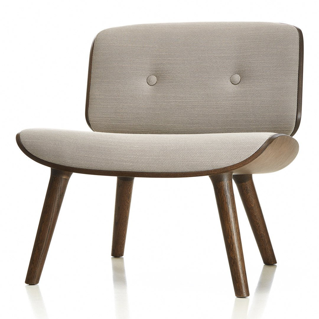 Light beige fabric lounge chair with two button accents and smooth wooden legs. Modern, minimalist design.