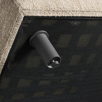 Black and beige contrast with a textured pattern, showcasing a sleek architectural design element.