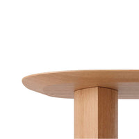 Light wood tabletop with a smooth, rounded edge and a solid rectangular leg, showcasing natural wood grain.