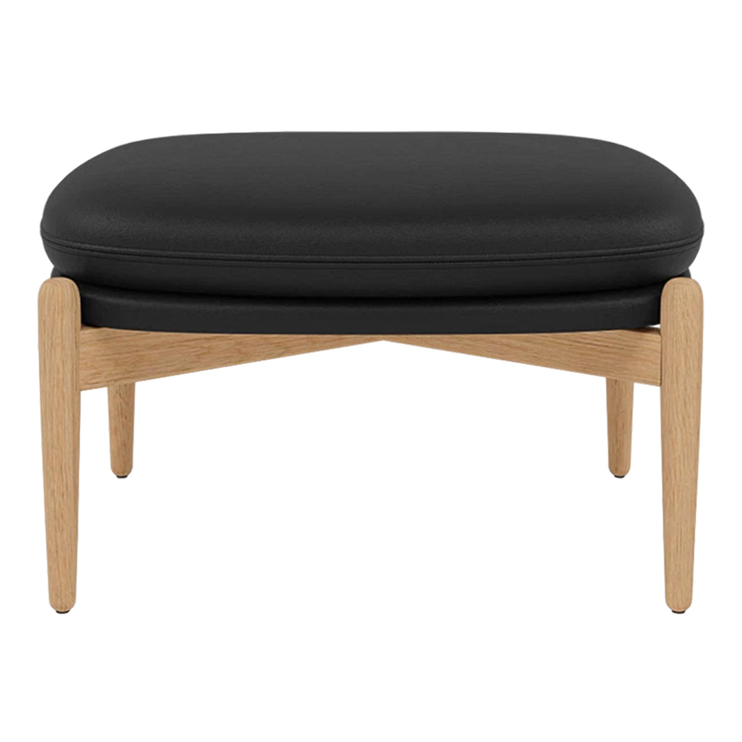 Black upholstered ottoman with a clean, minimalist design and natural wood legs. Perfect for contemporary decor.