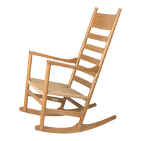 Natural oak rocking chair with a smooth, light wooden finish and a minimalist slatted design.