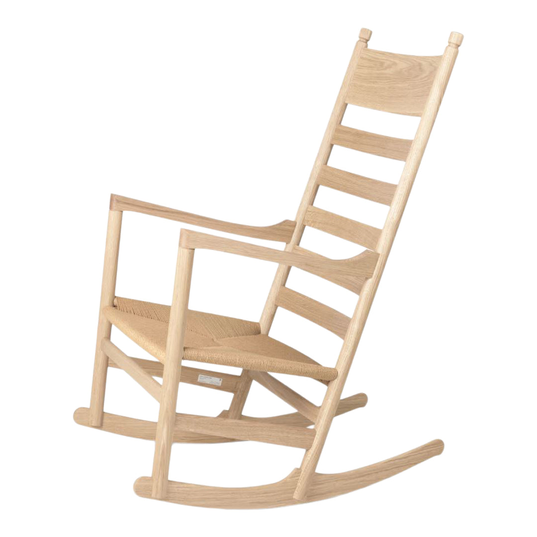 Light natural wood rocking chair with a simple, slatted design. Perfect for a minimalist aesthetic.