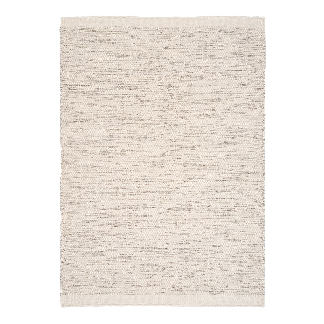 Textured cream area rug with subtle light beige and taupe streaks, enhancing warmth and elegance in any space.