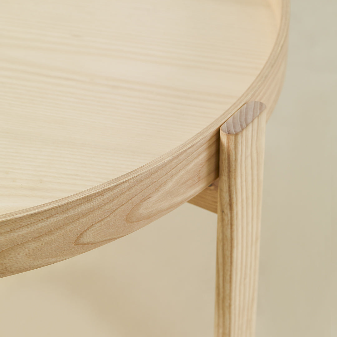 Light natural wood grain table with smooth round edges and a minimalist design. Perfect for modern decor.