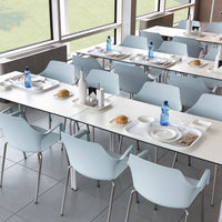 Light blue chairs and white tables in a spacious dining area with elegant minimalistic design and clean lines.