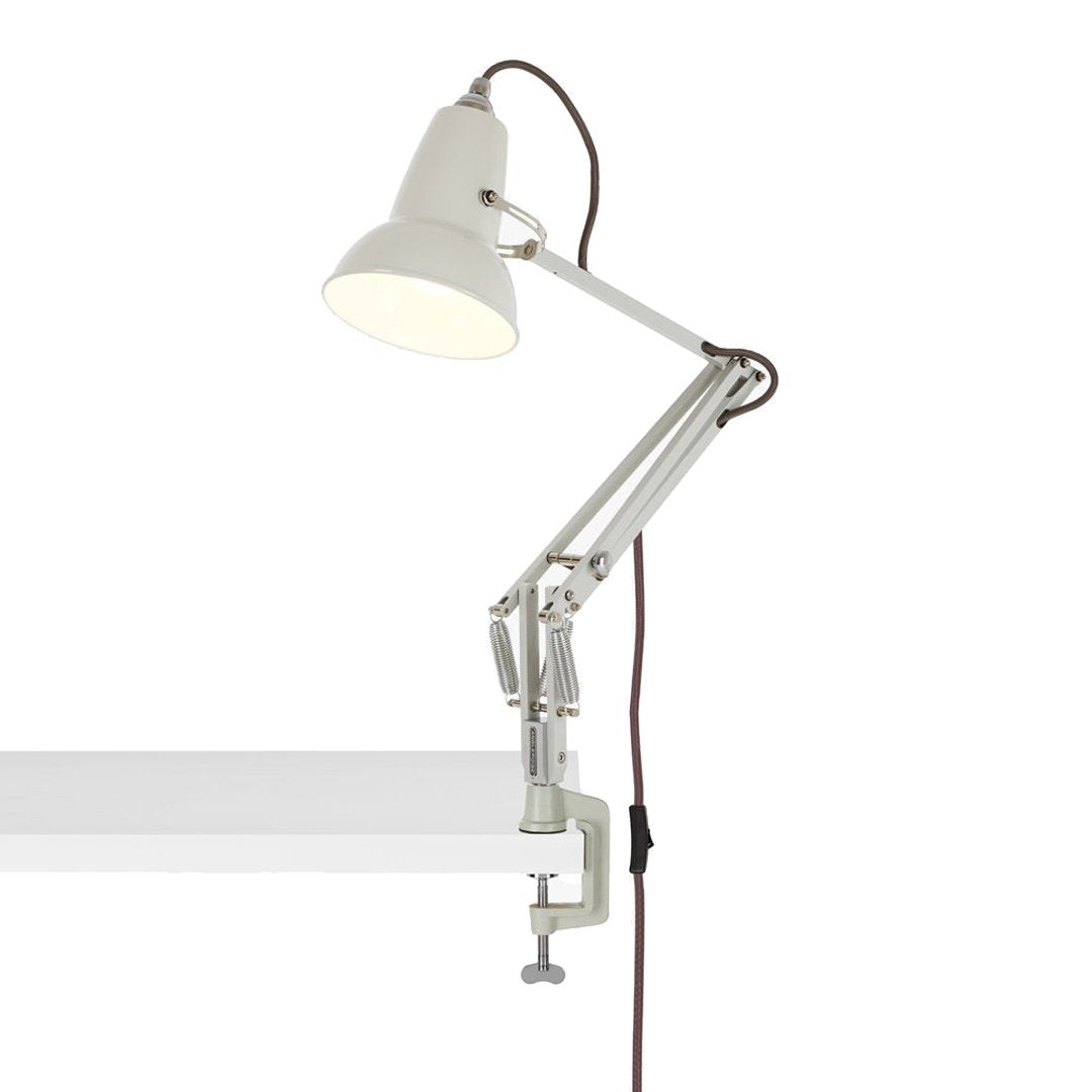White metal desk lamp with a sleek design and adjustable arm, featuring a classic gray and brown cord.
