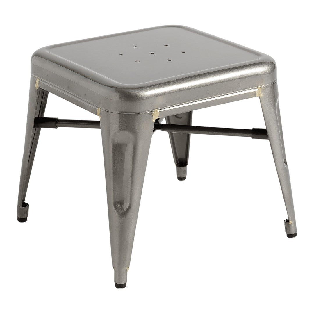 Metallic silver stool with a sleek, minimalist design and a perforated seat pattern for modern decor.