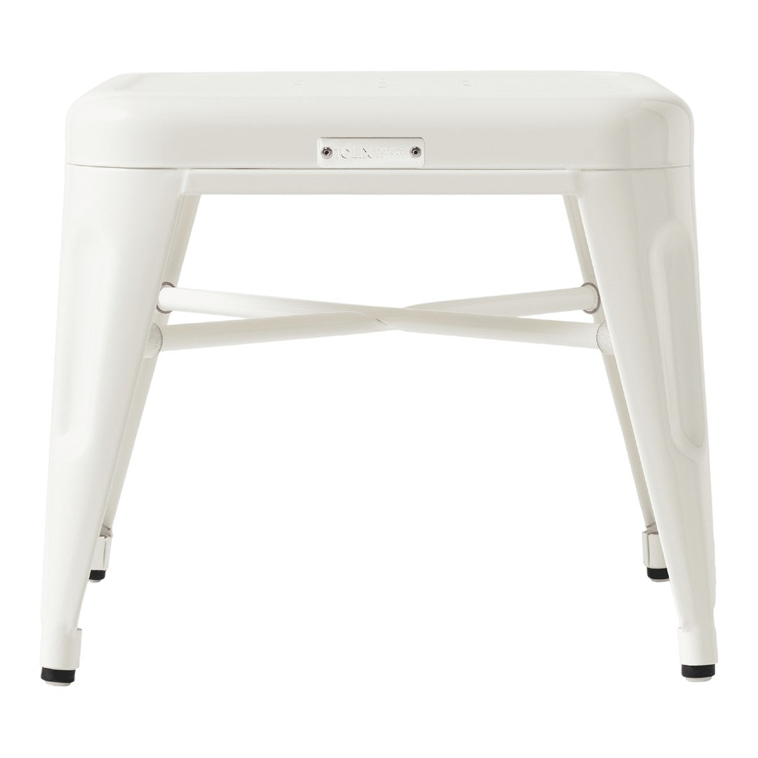 White metal stool with a smooth, glossy finish and minimalist design, perfect for modern decor.
