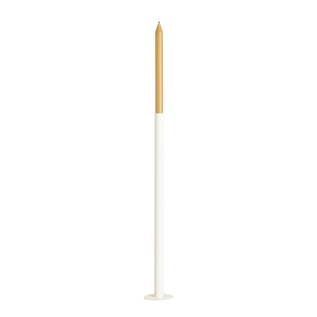 Elegant white candle holder with a tall, tapered cream and gold candle, perfect for decorative displays.