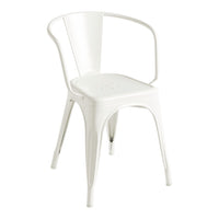 White metal chair with a minimalist design and smooth finish, featuring subtle perforations on the seat.