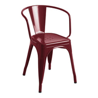 Red metal chair with a sleek, modern design and subtle perforated pattern on the seat for added style.