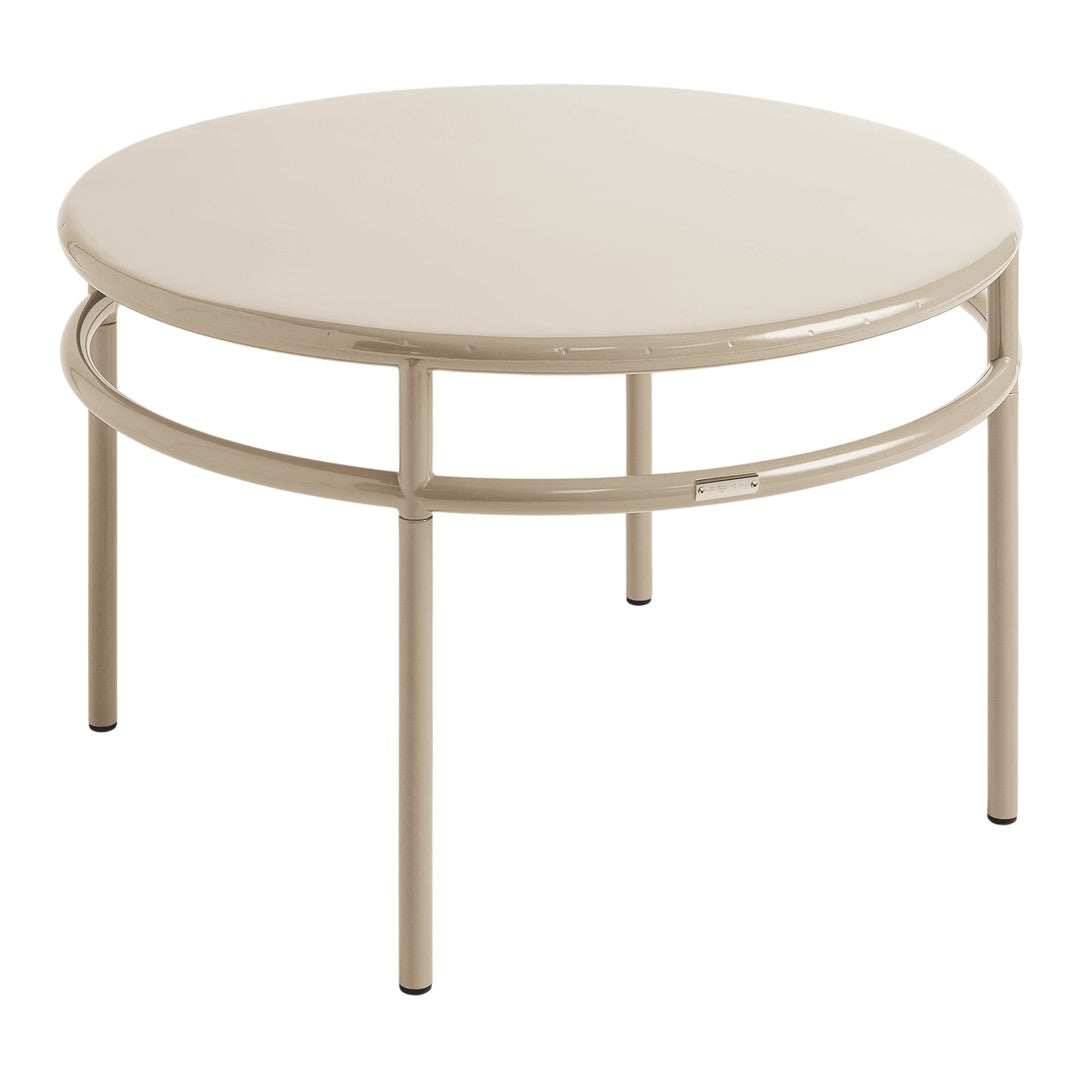 Round beige metal coffee table with a sleek, minimalist design and a smooth, glossy finish.