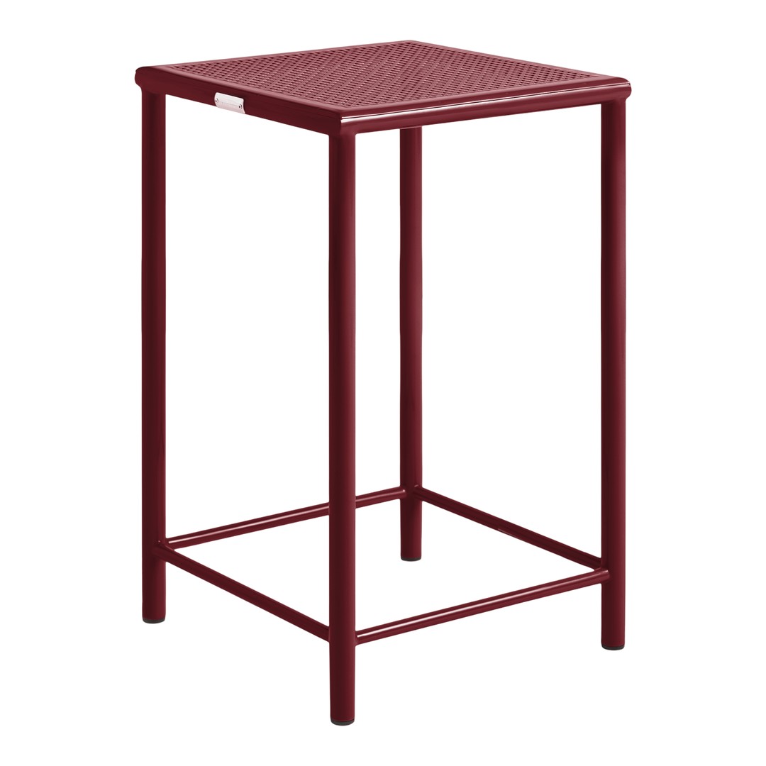 Burgundy bar stool with a textured diamond pattern and sleek metal frame, perfect for modern decor.