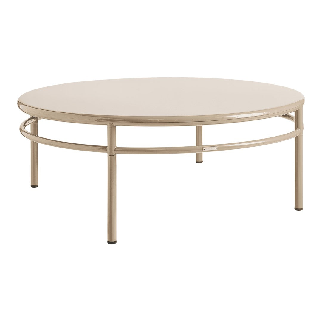 Round beige coffee table with a sleek, minimal design and smooth surface, featuring a circular frame and sturdy legs.