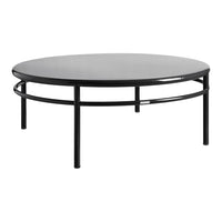 Round black coffee table with a sleek matte top and minimalistic metal frame, featuring a simple, modern design.