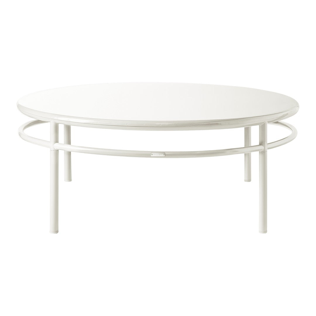 White round coffee table with a sleek, minimalist design and smooth surface, supported by a simple circular frame.