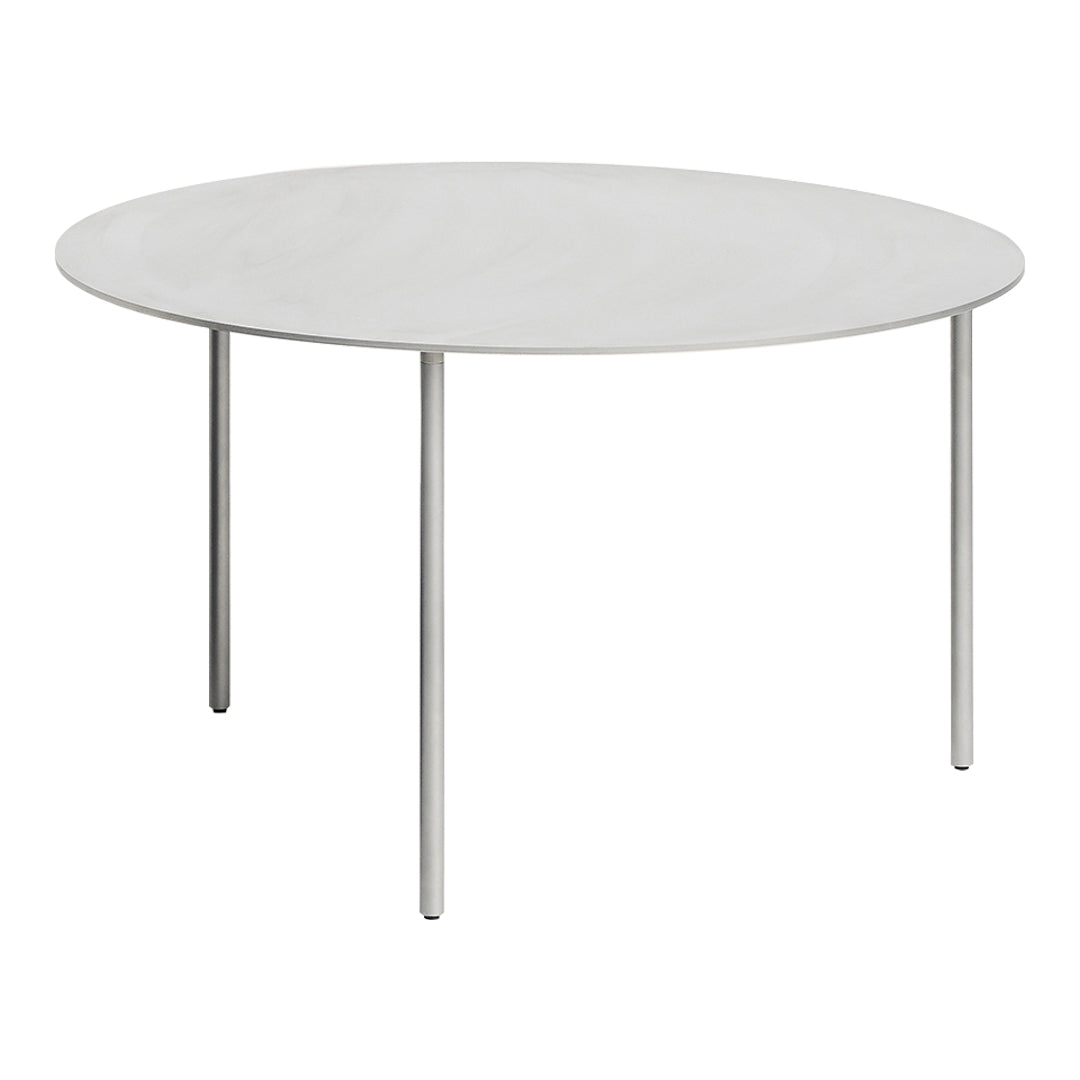 Round white table with a smooth surface and sleek silver legs, perfect for minimalist decor.