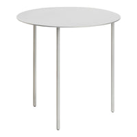 Minimalist round table with a sleek white top and slender silver legs, perfect for modern decor.