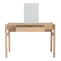 Light wood desk with a natural finish and a minimalist white mirror, featuring clean lines and a modern design.