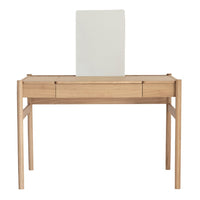 Light wood desk with a smooth natural finish and a sleek white backdrop, featuring minimalistic design and no patterns.