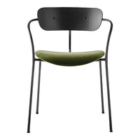 Black metal chair with a smooth, olive green velvet seat, showcasing a minimalist design.