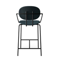 Modern black bar stool featuring a sleek dark teal seat and minimalistic design, perfect for contemporary spaces.