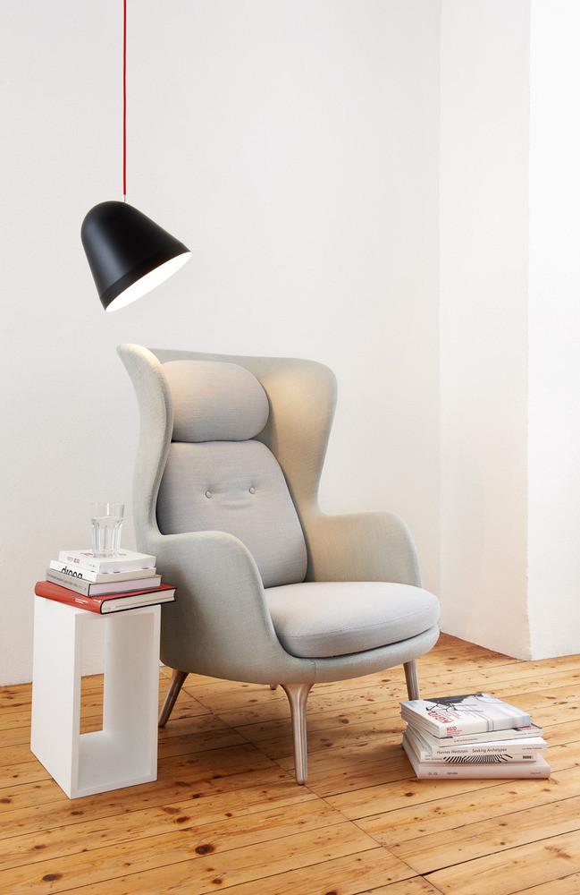 Stylish grey upholstered chair with a light and dark color scheme, featuring a smooth, modern design.