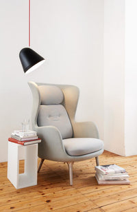 Stylish grey upholstered chair with a light and dark color scheme, featuring a smooth, modern design.