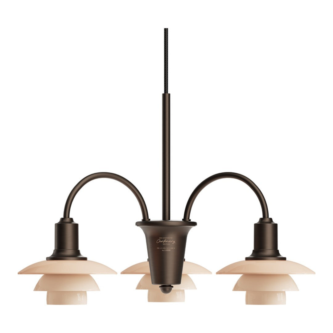 Copper-toned chandelier with cream layered shades, featuring a sleek, modern design and elegant curves.