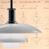 Sleek black pendant light with a smooth gray shade, featuring a subtle white accent at the base, on a vintage blueprint background.