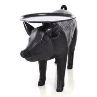 Black pig-shaped table with a glossy black tray, featuring a textured finish and playful design.