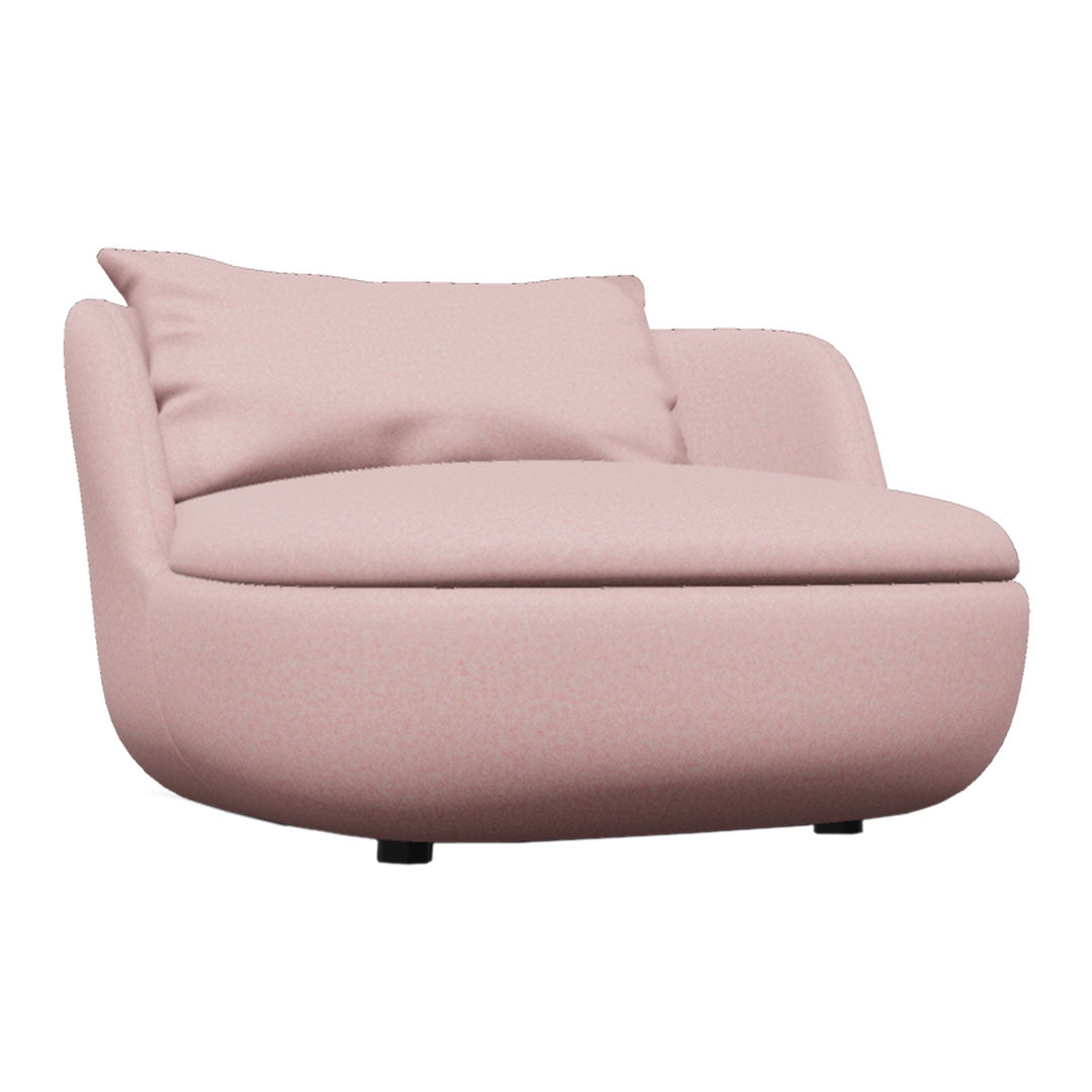 Soft pink upholstered chair with a smooth texture and a plush cushion. Ideal for modern interiors.