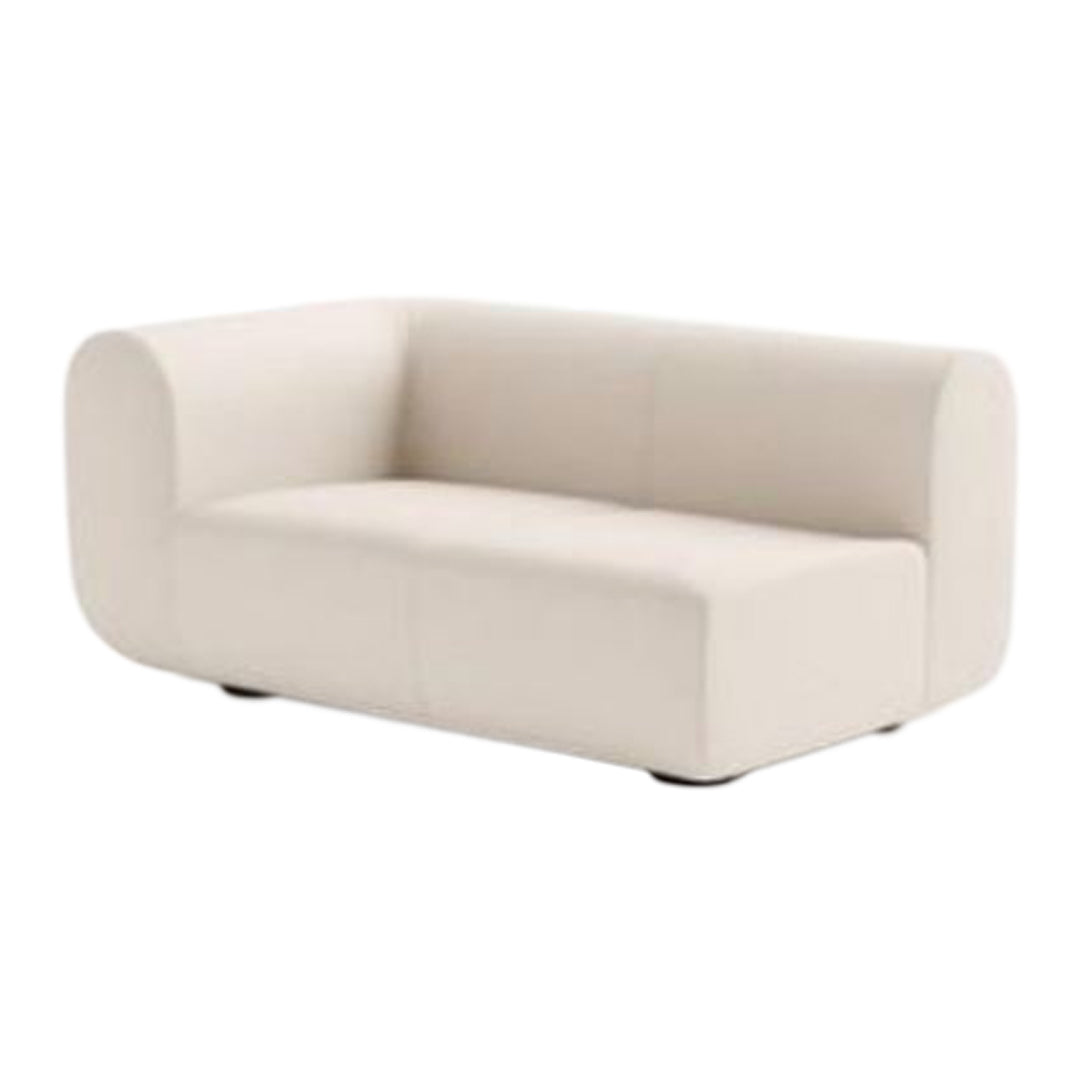 Cream-colored, minimalist sofa with smooth, solid fabric and rounded edges, perfect for modern decor.