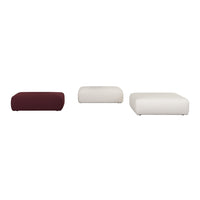 Gray upholstered storage ottoman on wheels, offering a sleek and minimalist design. Perfect for modern decor.