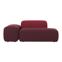 Maroon sofa with smooth, minimalist design featuring a rounded armrest and seamless upholstery pattern.