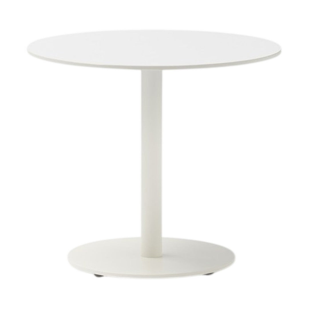 Modern white round table with a smooth finish and minimalistic design, perfect for any contemporary space.