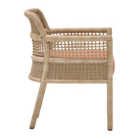 Beige woven chair with open weave design and soft coral cushioning. Elegant and modern aesthetic for indoor or outdoor use.