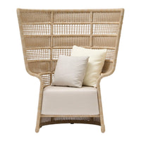 Natural woven rattan chair with a unique high back, featuring neutral beige cushions and soft cream pillows.